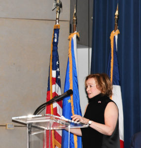 Debbie Dunn speaking at a podium during the France and the American Revolution panel April 21, 2019.
