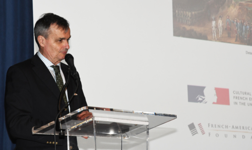 Former French ambassador Gérard Araud speaking at a podium in front of a screen at the April 21, France and the American Revolution event. © France in the US